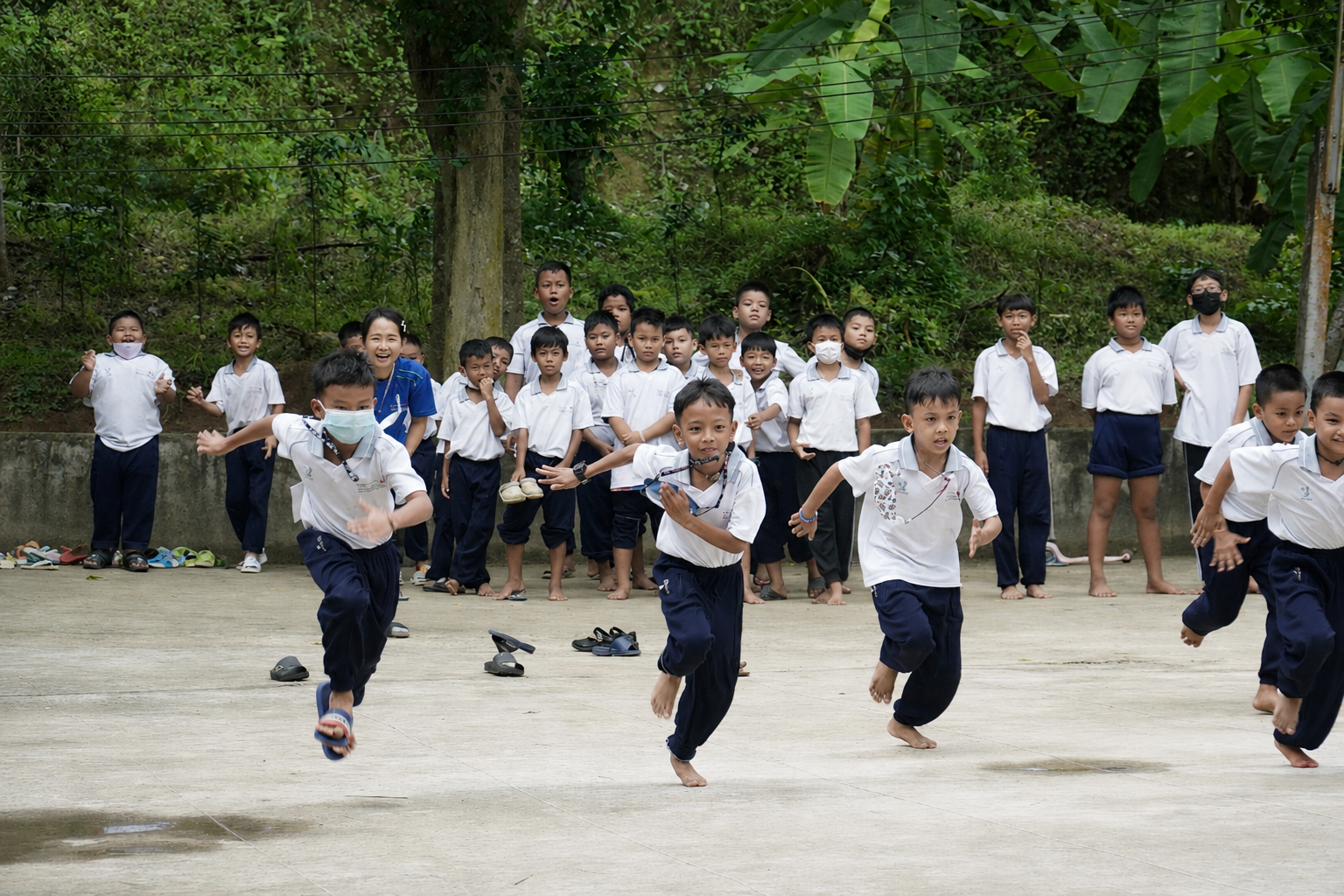 Children running outdoors together